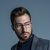 young handsome businessman in formal suit and glasses e1618243153342